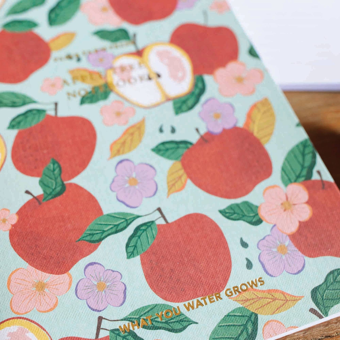 What you Water Grows Apple Tree  Stitched Notebook